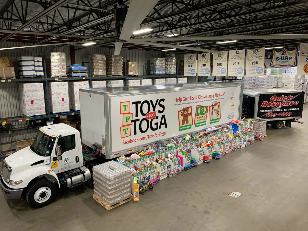 Donated toys in front of Toys for Tots truck