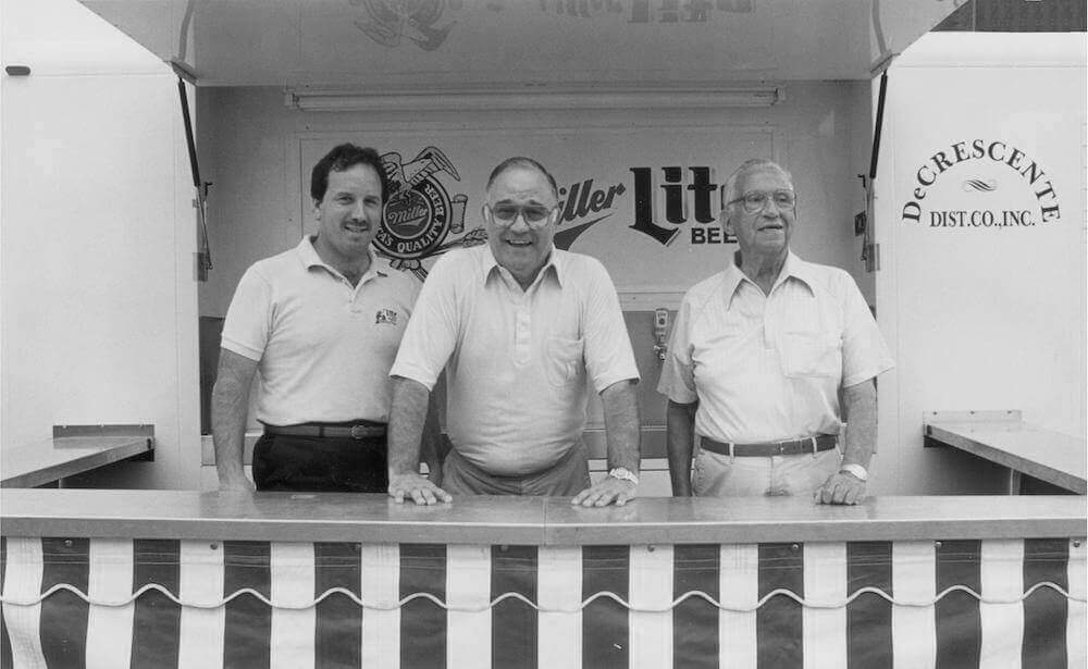 Three men in front of a DeCrescente beer truck